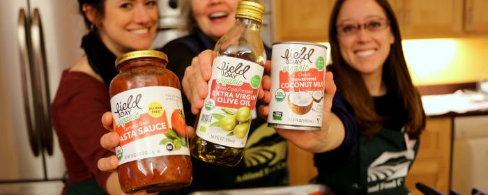 Women hold basics products