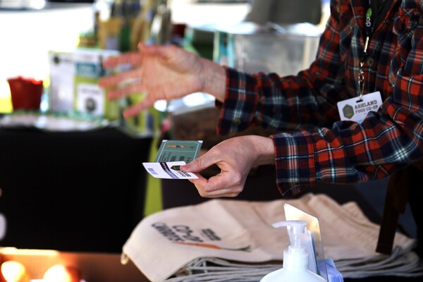 Hands holding a Co-op membership card