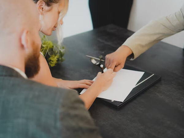 woman writing on a piece of paper