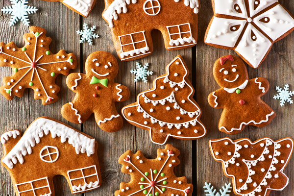 decorated gingerbread cookies on a wooden backdrop