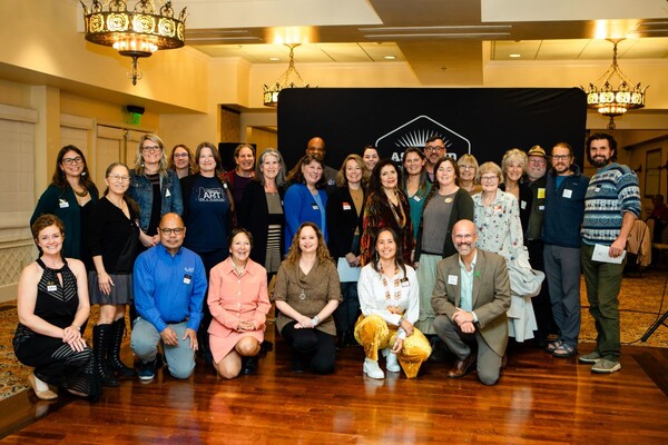 Grant recipients standing and smiling.