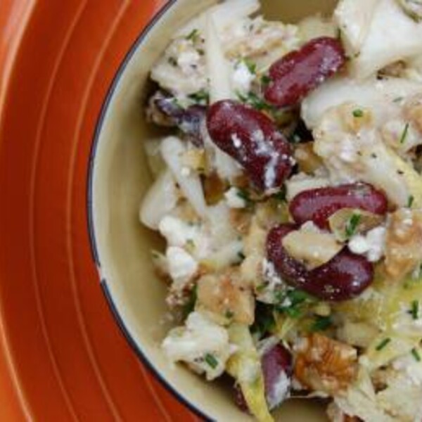 cauliflower kidney bean and feta salad on an orange plate