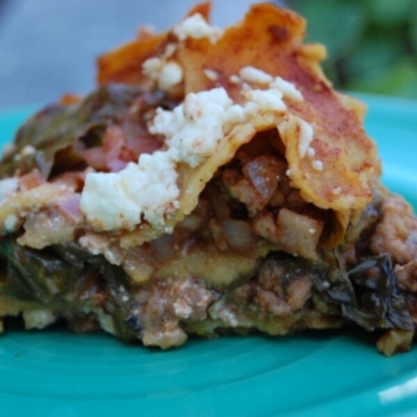 chorizo enchiladas on a turquoise plate