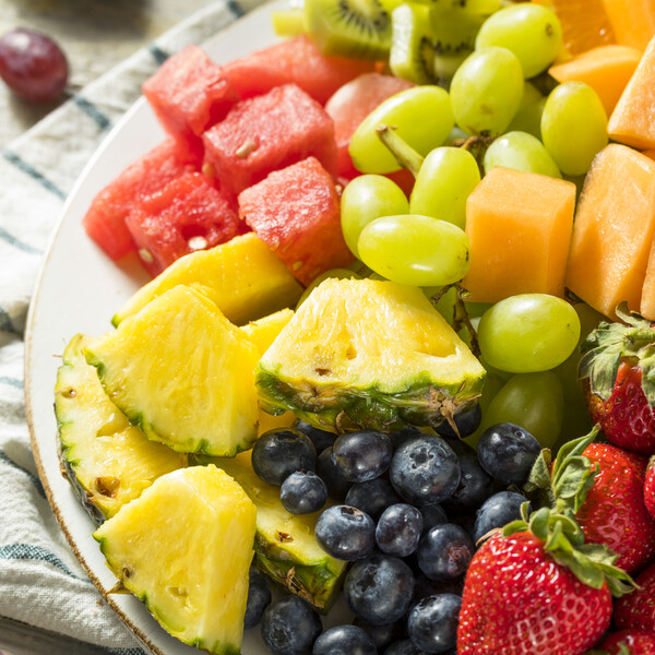platter of fresh fruit on a white plate